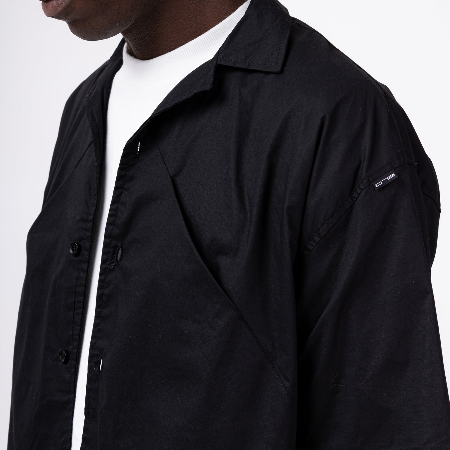 CAMISETA BOX BOTÃO “FOLD”